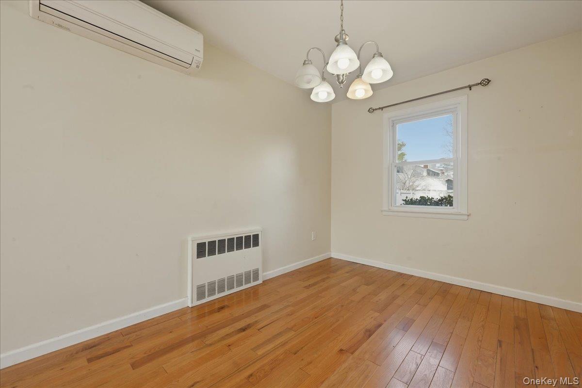 1719 William Street Merrick, NY 11566 - Photo 13 of 38 a view of a room with wooden floor