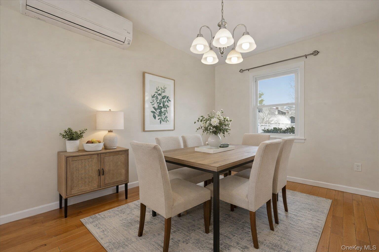 1719 William Street Merrick, NY 11566 - Photo 14 of 38 a view of a dining room with furniture and wooden floor