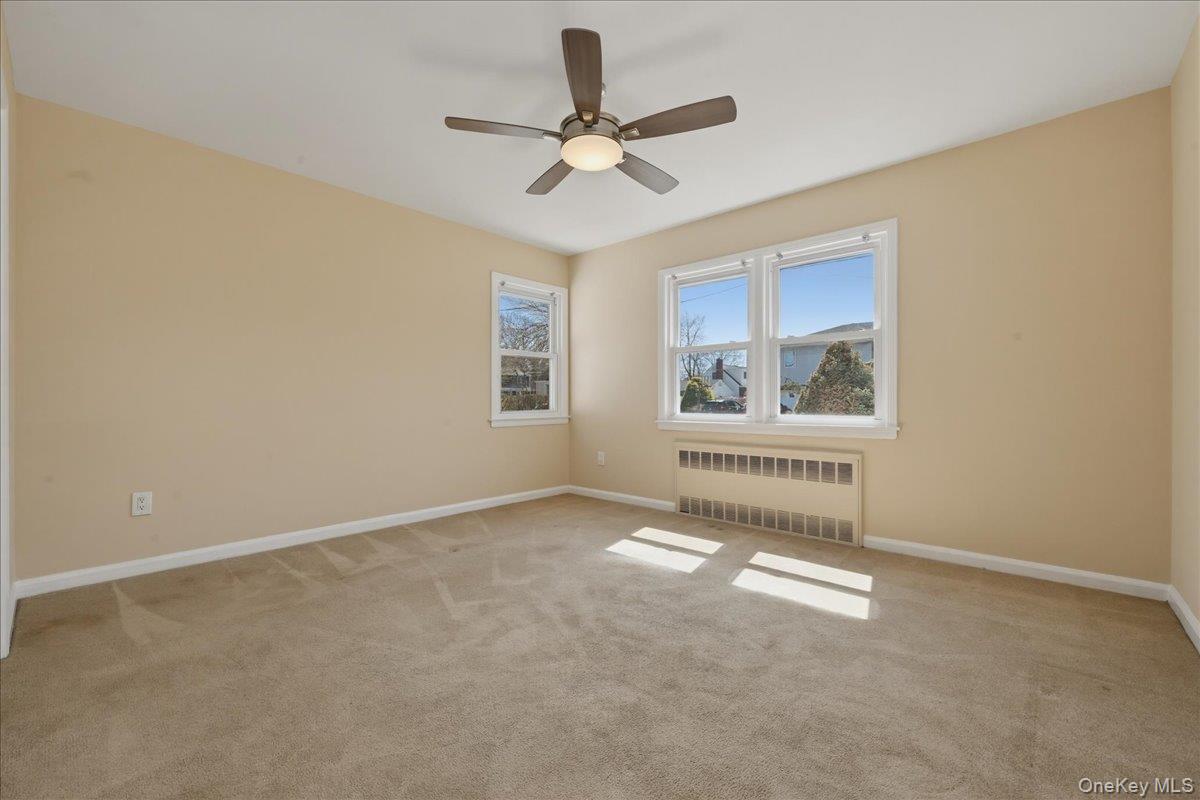 1719 William Street Merrick, NY 11566 - Photo 19 of 38 a view of an empty room with a window