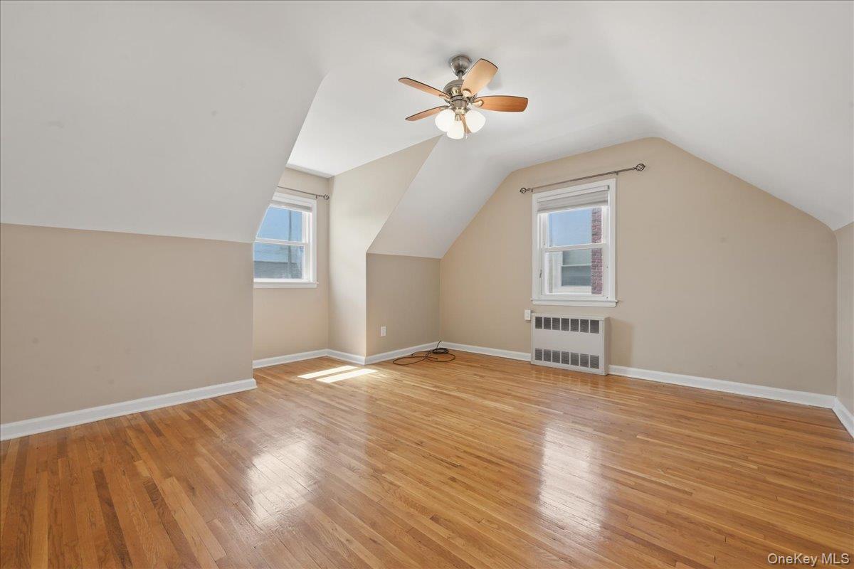 1719 William Street Merrick, NY 11566 - Photo 23 of 38 a view of an empty room with a window and wooden floor