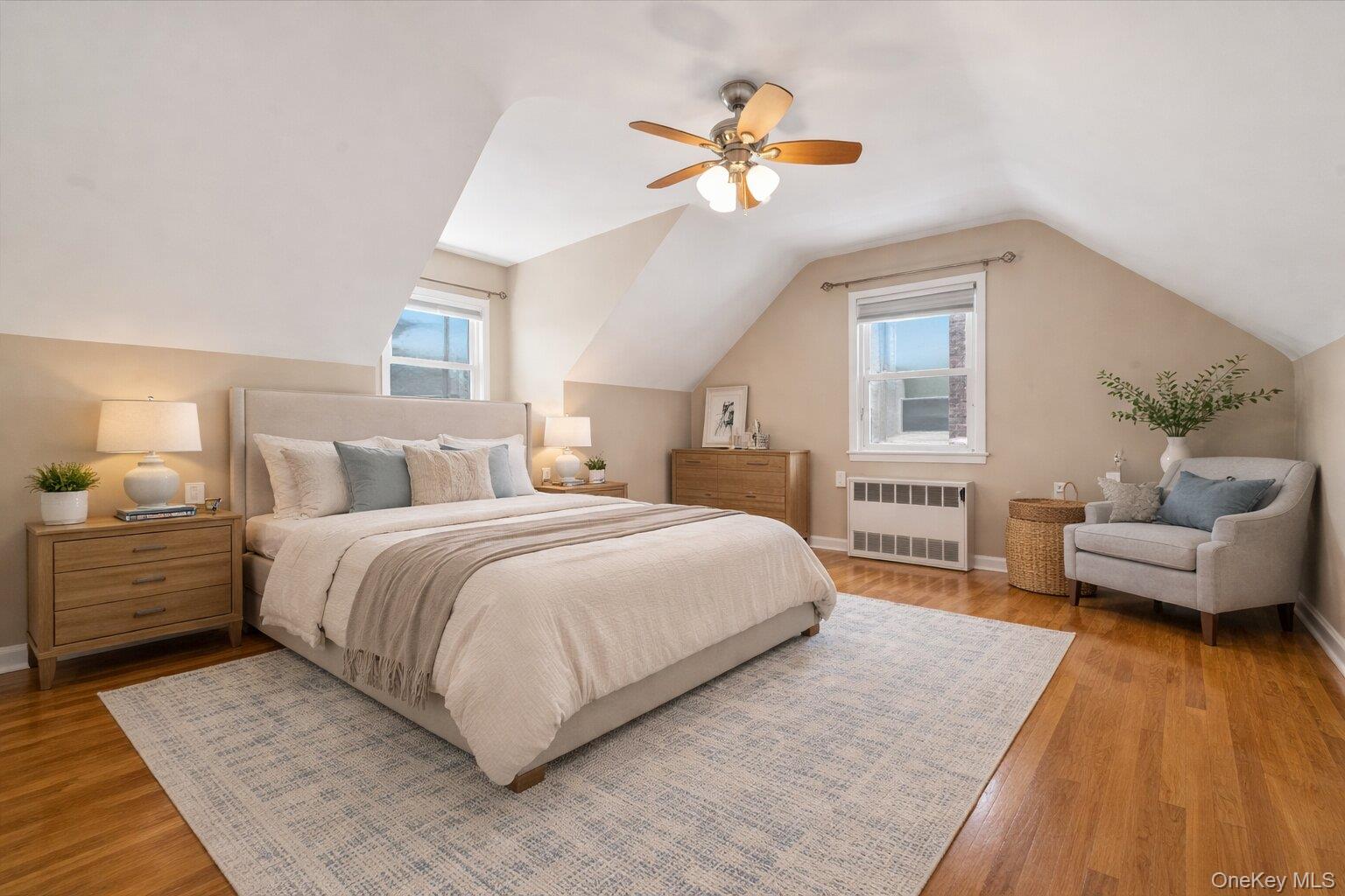 1719 William Street Merrick, NY 11566 - Photo 24 of 38 a bedroom with a large bed and a chandelier