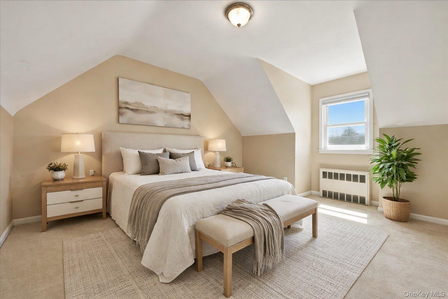 1719 William Street Merrick, NY 11566 - Photo 27 of 38 a bedroom with a large bed and a potted plant
