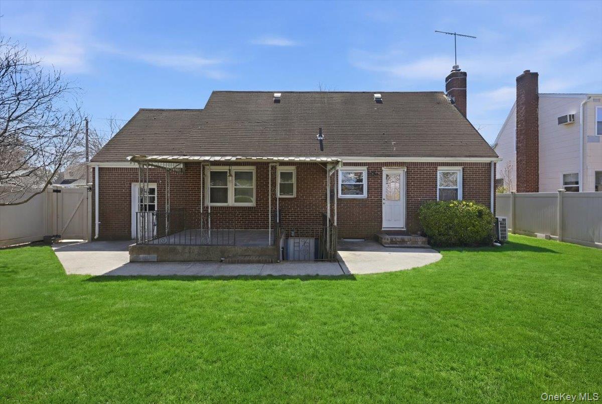 1719 William Street Merrick, NY 11566 - Photo 31 of 38 a view of a house with a yard and potted plants
