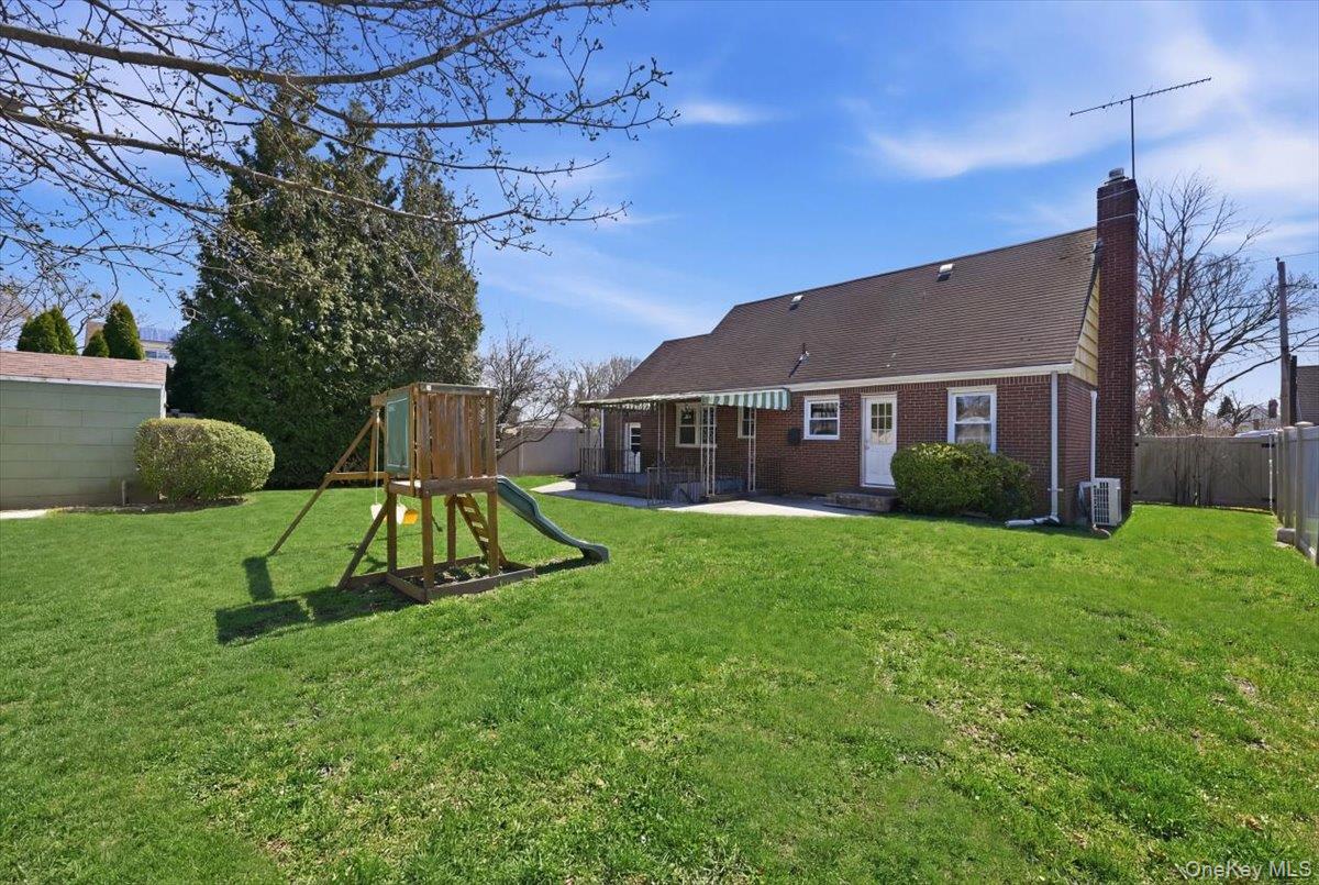 1719 William Street Merrick, NY 11566 - Photo 32 of 38 a view of a house with a yard