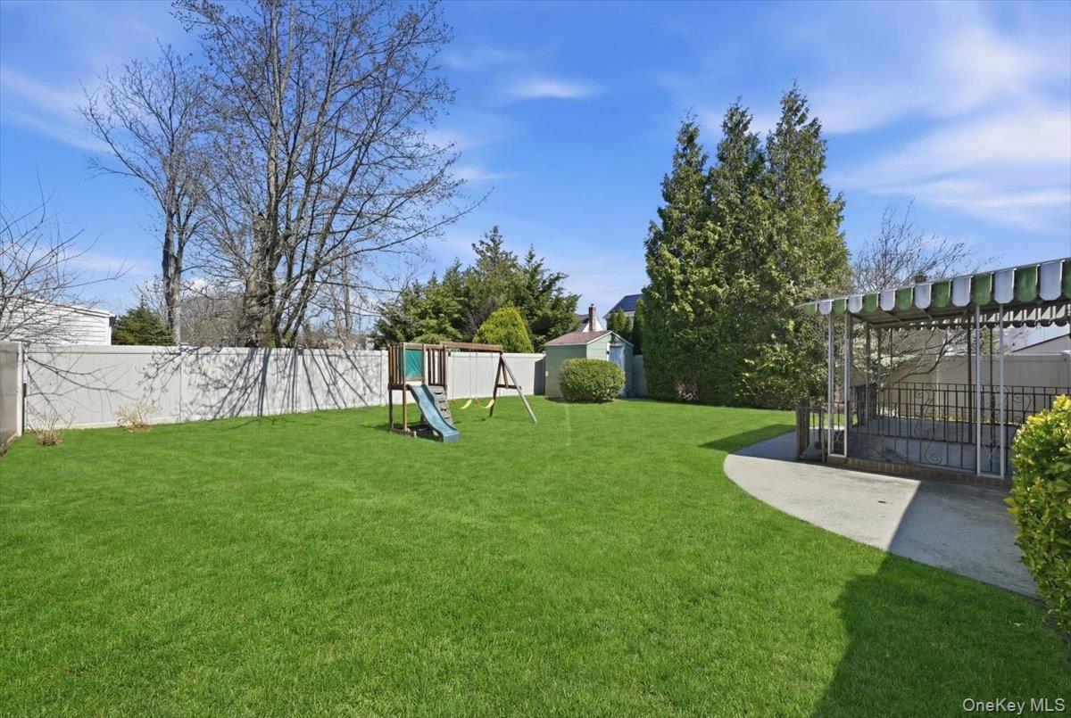 1719 William Street Merrick, NY 11566 - Photo 35 of 38 a view of a park with a large trees