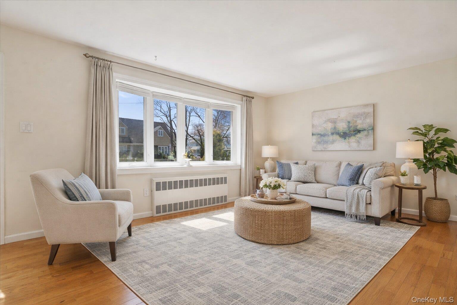 1719 William Street Merrick, NY 11566 - Photo 7 of 38 a living room with furniture and a window
