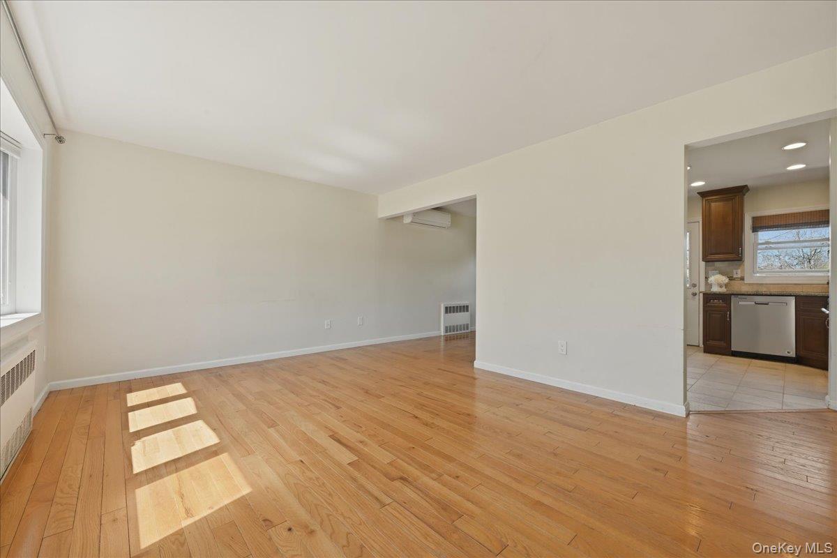 1719 William Street Merrick, NY 11566 - Photo 8 of 38 wooden floor in an empty room with a window