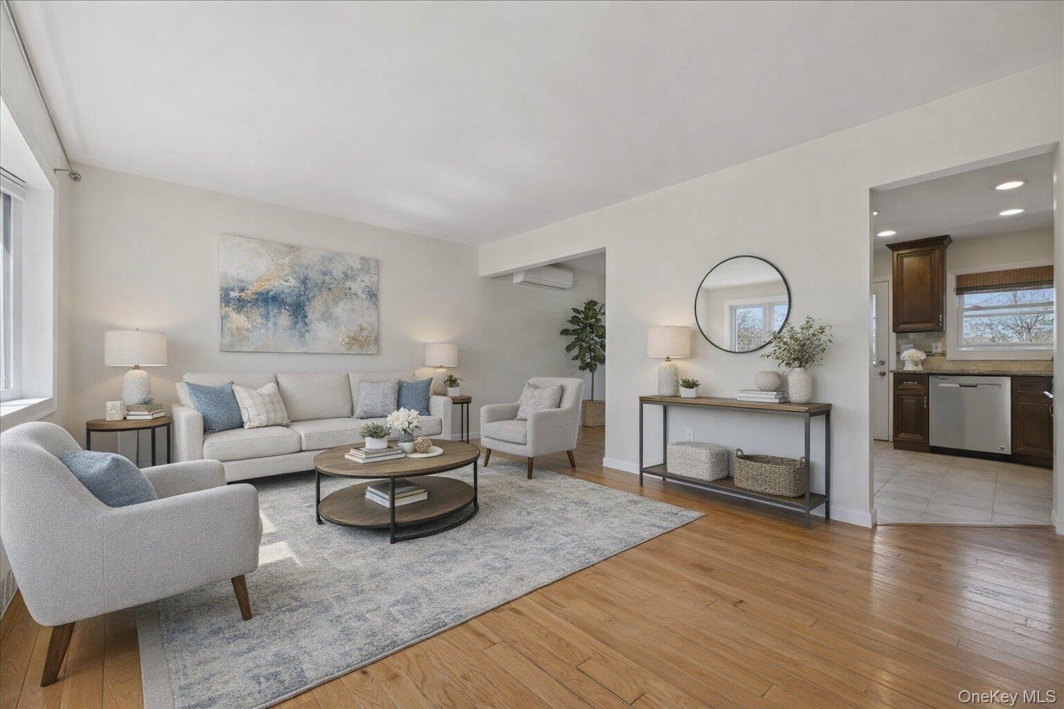 1719 William Street Merrick, NY 11566 - Photo 9 of 38 a living room with furniture a fireplace and a flat screen tv