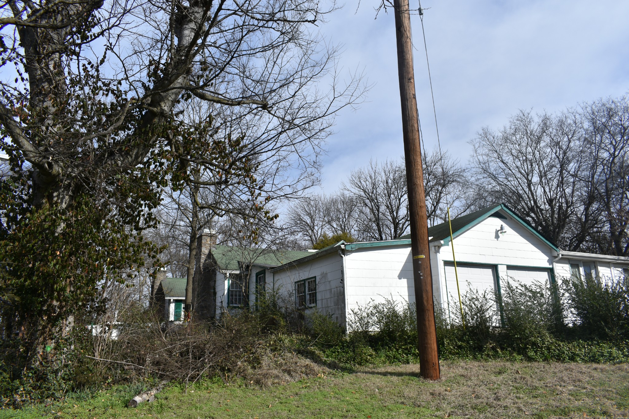 209 Hillcrest Drive Madison, TN 37115 - Photo 2 of 27 a view of house with trees in front of it