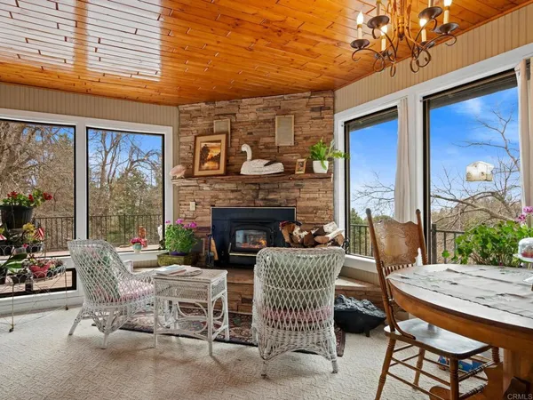 a view of a patio with a table and chairs