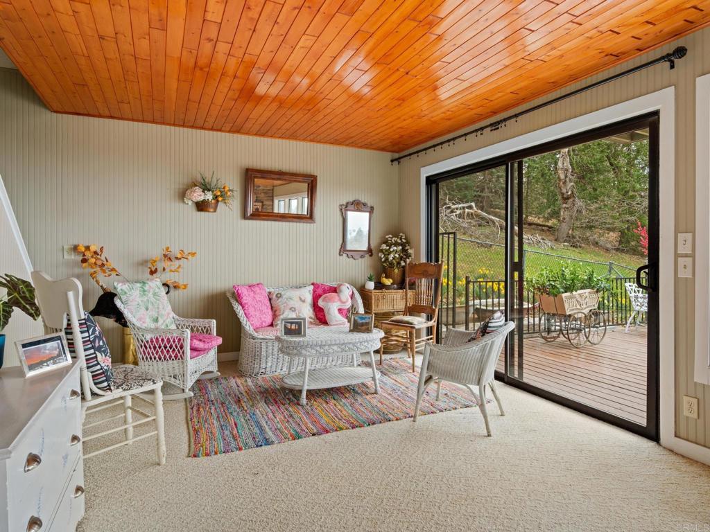 22209 Crestline Road Palomar Mountain, CA 92060 - Photo 21 of 51 a living room with furniture and a large window
