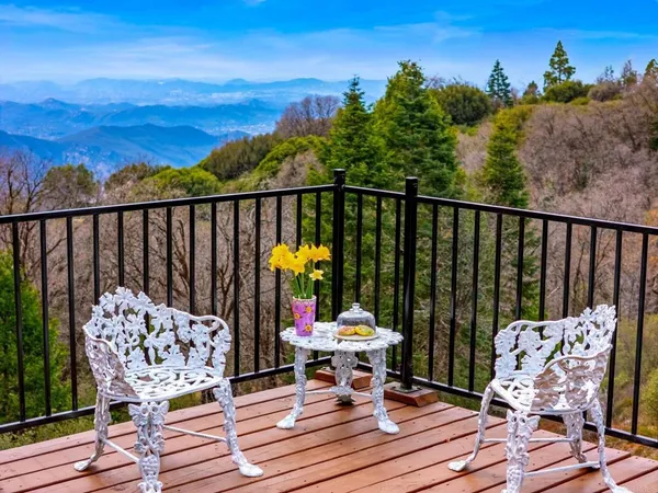 a view of a chairs on wooden deck