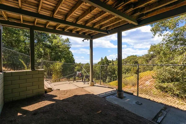a backyard of a house with lots of trees