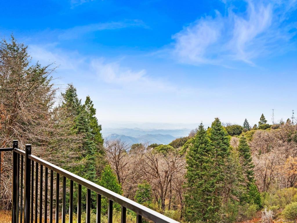 22209 Crestline Road Palomar Mountain, CA 92060 - Photo 6 of 51 a balcony with an outdoor space