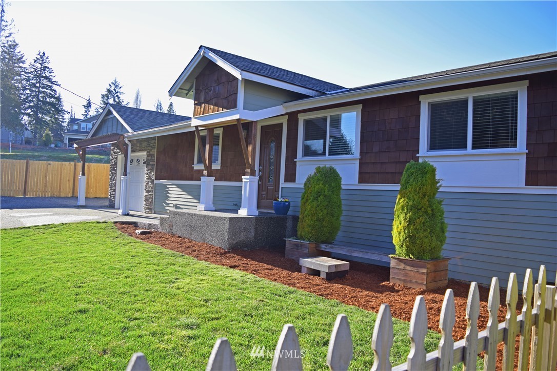 703 Bing Road, Unit A Lynnwood, WA 98036 - Photo 2 of 13 a view of a house with backyard