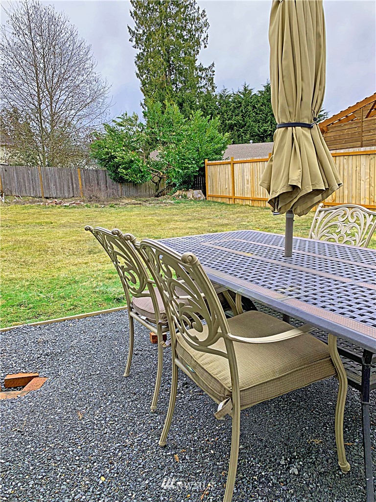 703 Bing Road, Unit A Lynnwood, WA 98036 - Photo 11 of 13 a view of a swimming pool with a patio