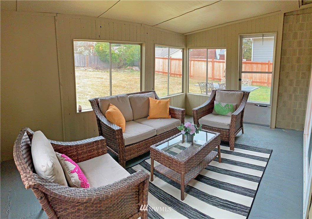 703 Bing Road, Unit A Lynnwood, WA 98036 - Photo 13 of 13 a living room with furniture and a window