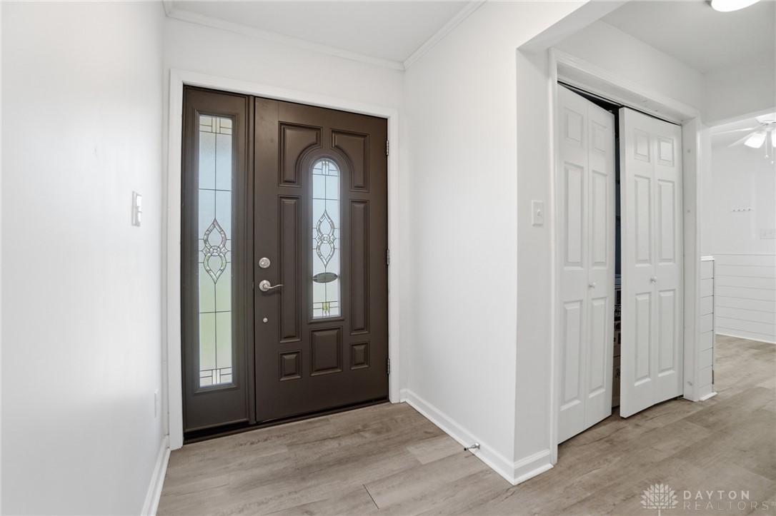 629 Storms Road Dayton, OH 45429 - Photo 12 of 51 Elegant entry door with decorative glass welcomes you into a bright and inviting space.