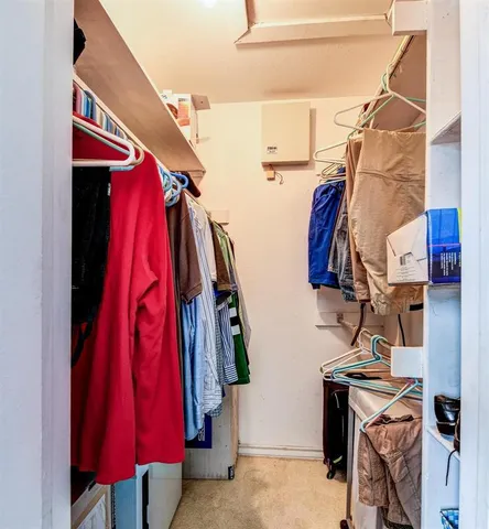 a bed room with a walk in closet
