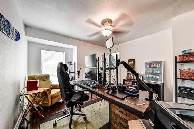 a view of a workspace with furniture