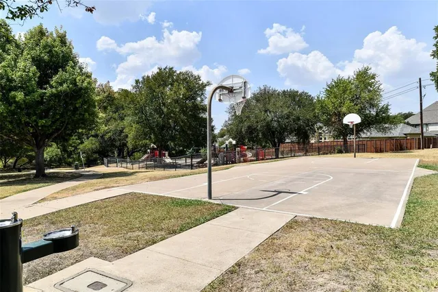 a swimming pool with an outdoor space and seating area