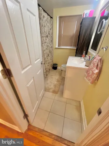 a bathroom with a sink a mirror and shower