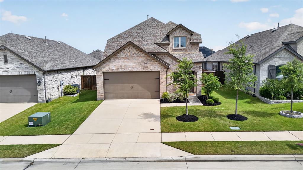 629 Claverton Lane Forney, TX 75126 - Photo 31 of 33 a front view of a house with garden