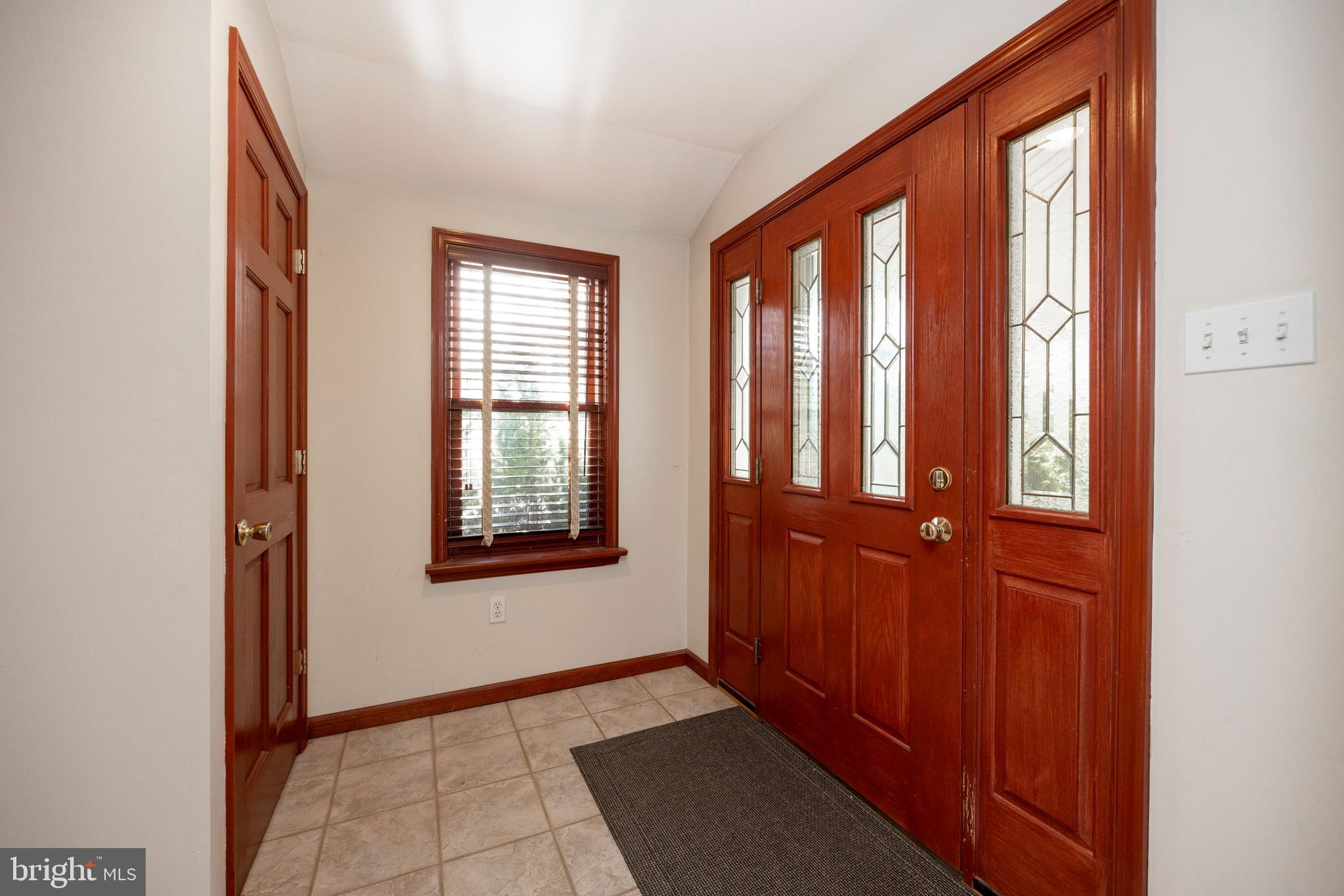 68 Spring Mt Road Schwenksville, PA 19473 - Photo 4 of 35 a view of an entryway with window