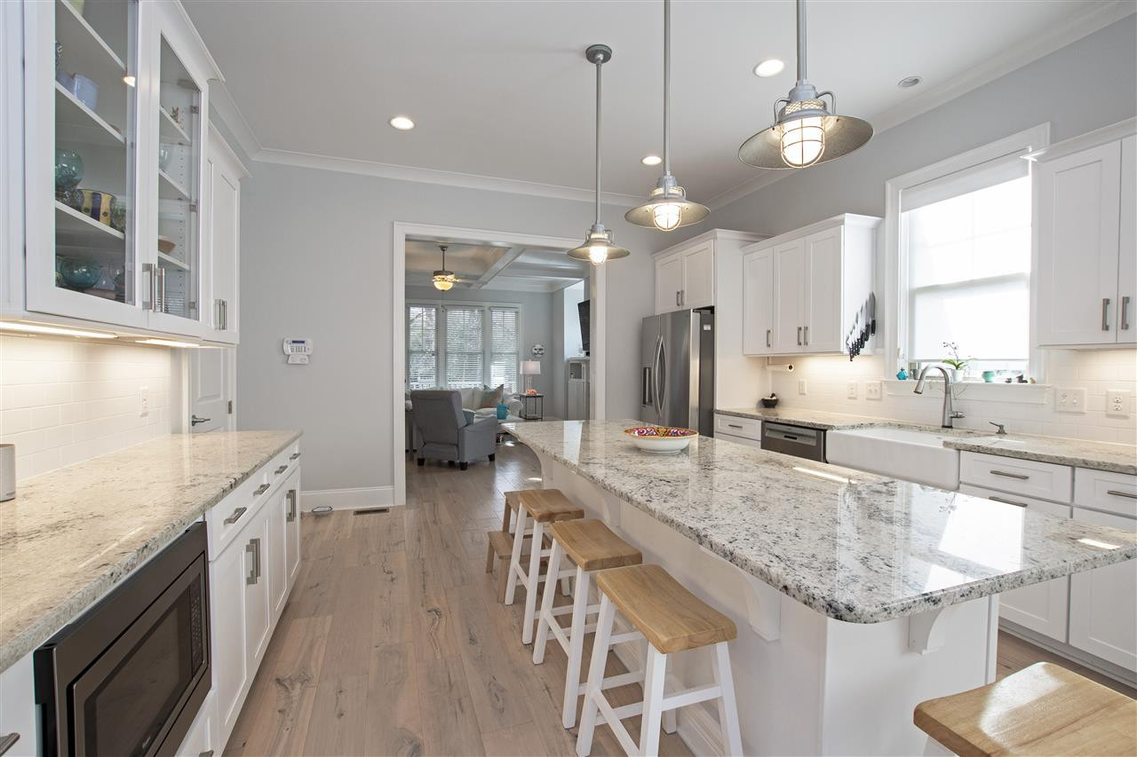 221 Gardner Street Raleigh, NC 27607 - Photo 9 of 25 Additional Counter Space/ seating & pantry at the end on the left.