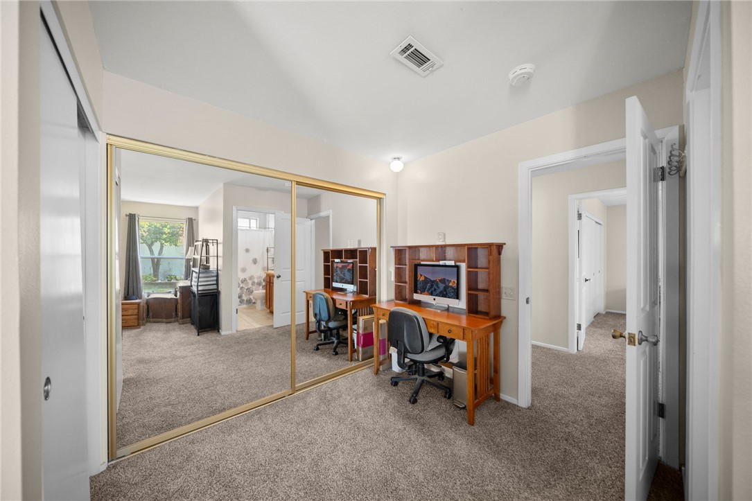 27879 Foxfire Street Menifee, CA 92586 - Photo 27 of 36 a view of a livingroom with workspace and a window