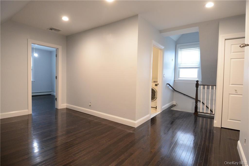 53 Dewitt Avenue, Unit 2 Bronxville, NY 10708 - Photo 14 of 19 an empty room with wooden floor and a window