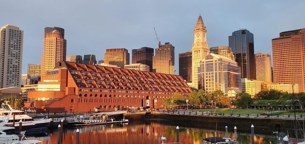 59 Commercial Wharf, Unit 1 Boston, MA 02110 - Photo 17 of 19 a view of a city with tall buildings