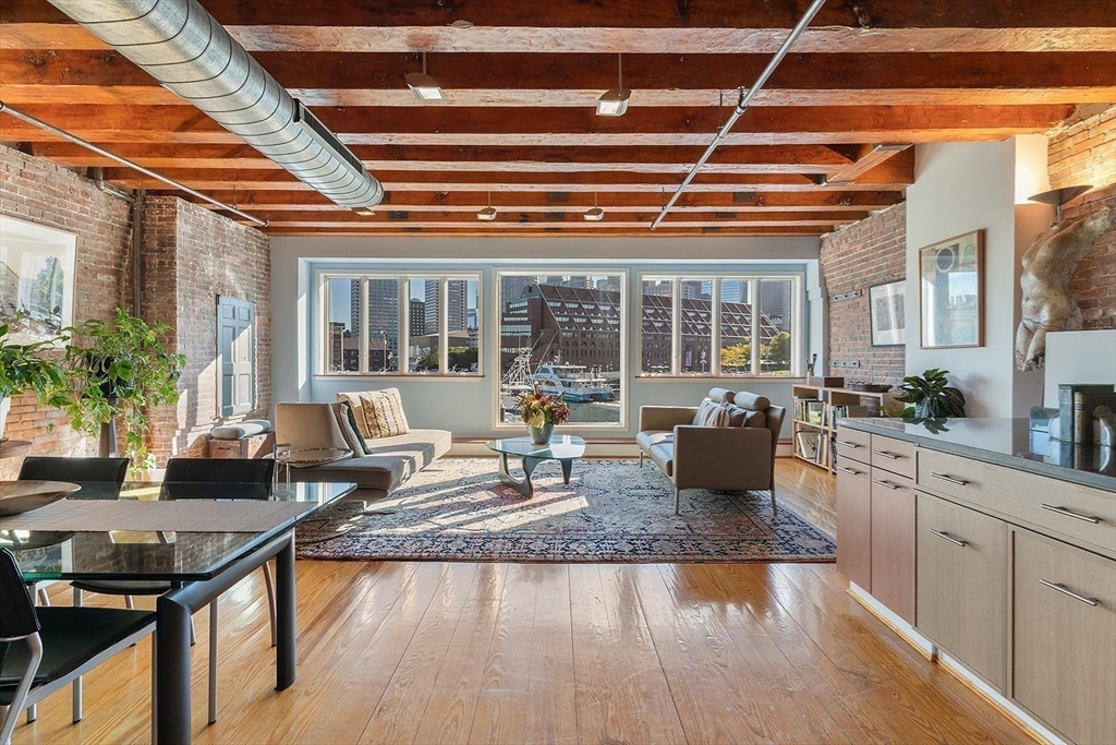 59 Commercial Wharf, Unit 1 Boston, MA 02110 - Photo 2 of 19 a kitchen with sink stove and cabinets