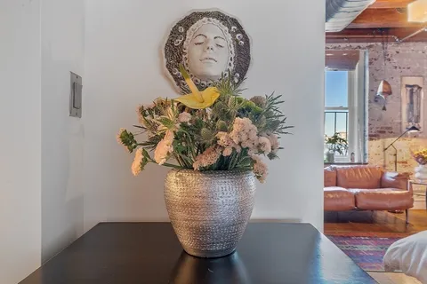 a vase of flowers sitting on a table