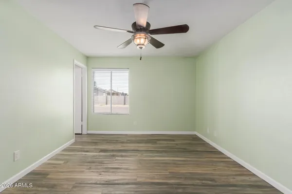 a view of room with window and ceiling fan
