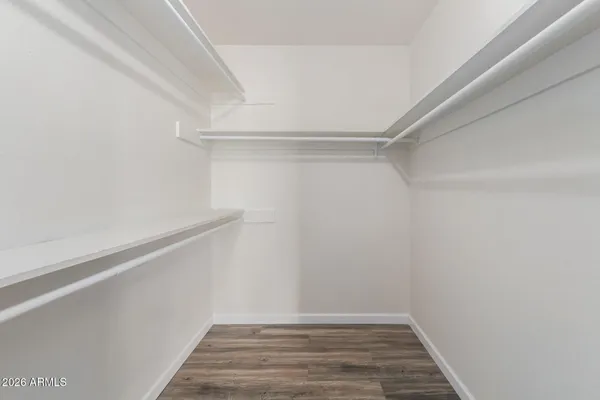 a view of an empty walk in closet