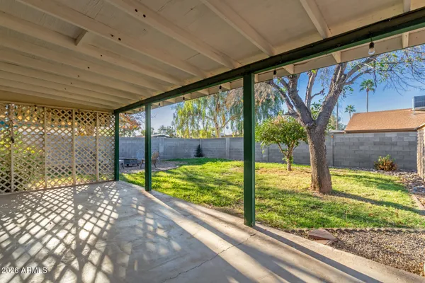a view of swimming pool with a backyard