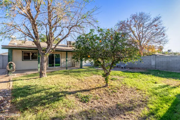 a house with trees in the background