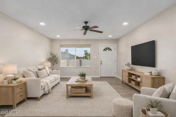 a living room with furniture and a flat screen tv