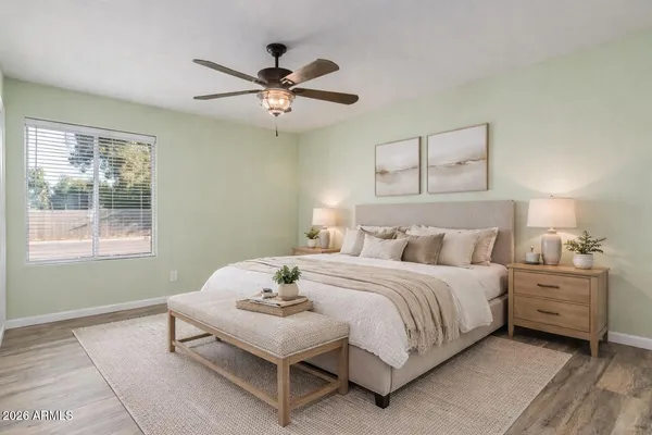 a bedroom with a bed and a window