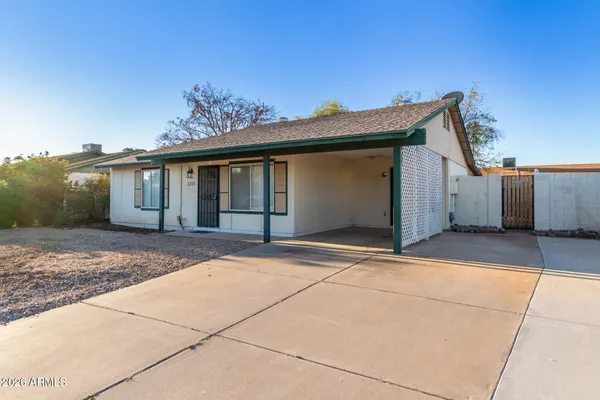 a view of house with a garage