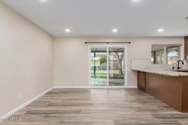 a view of kitchen and wooden floor