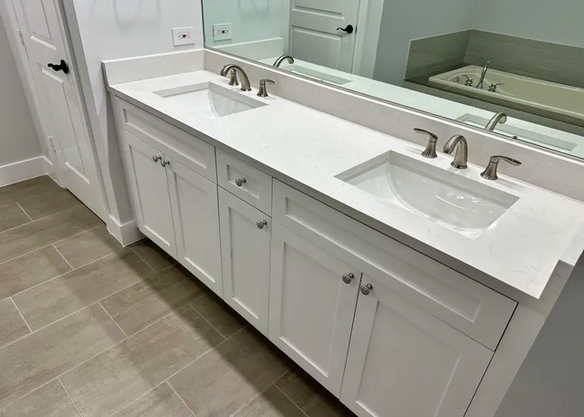 a bathroom with a double vanity sink and a mirror