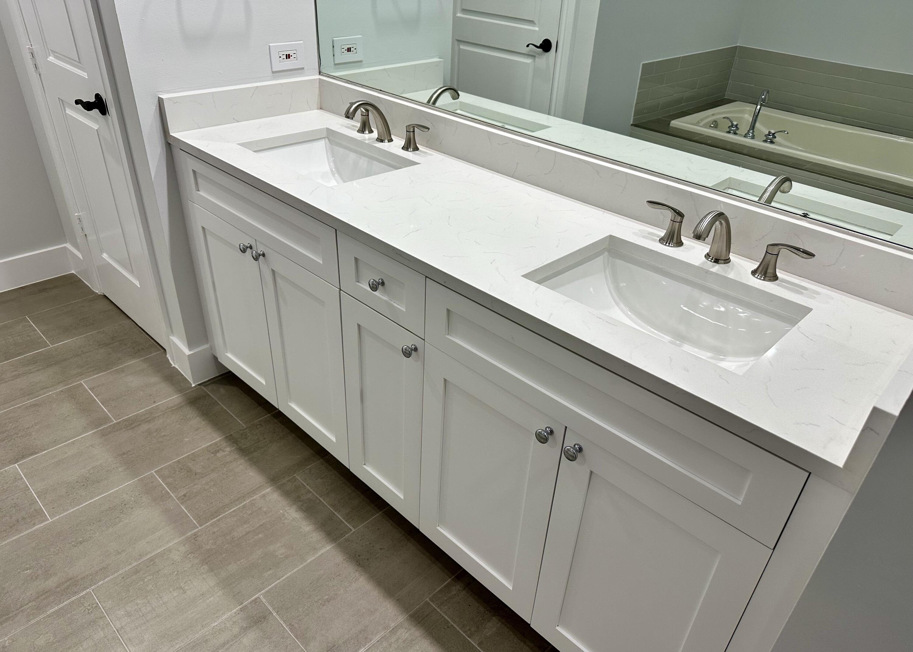 200 Northeast 2nd Avenue, Unit 312 Delray Beach, FL 33444 - Photo 19 of 30 a bathroom with a double vanity sink and a mirror