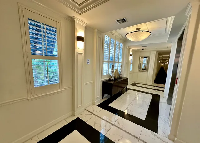 a view of an entryway with wooden floor