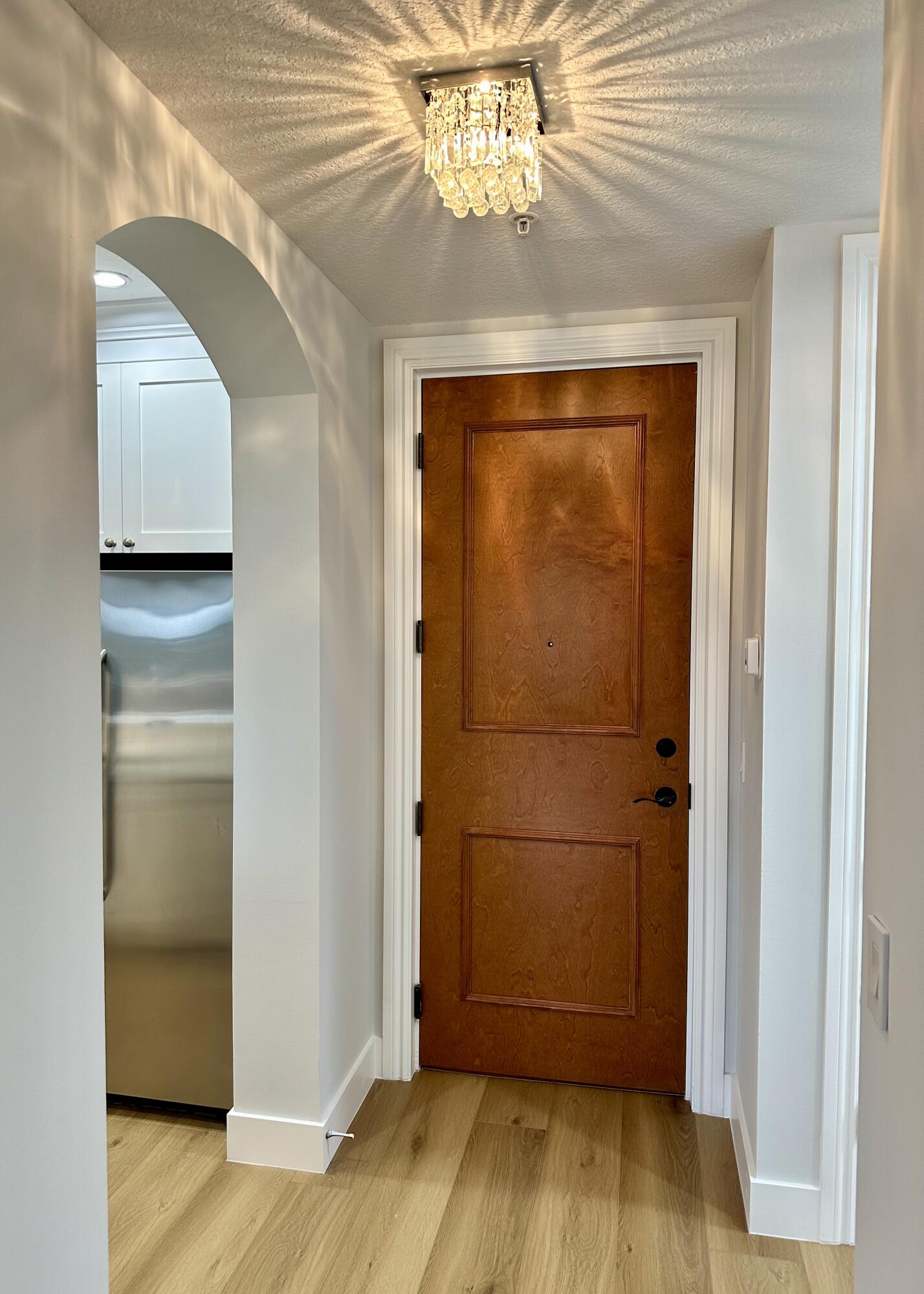 200 Northeast 2nd Avenue, Unit 312 Delray Beach, FL 33444 - Photo 7 of 30 a view of a hallway with wooden floor