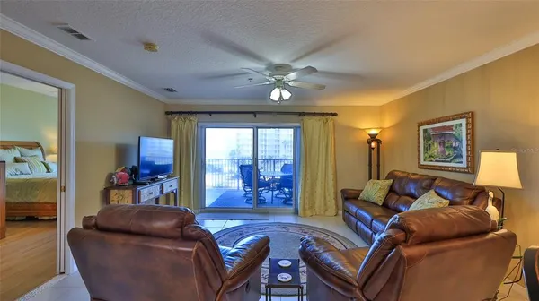 a view of a livingroom with furniture window and wooden floor