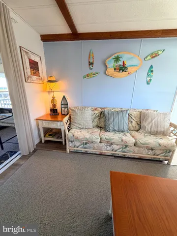 a bedroom with a bed and a mirror