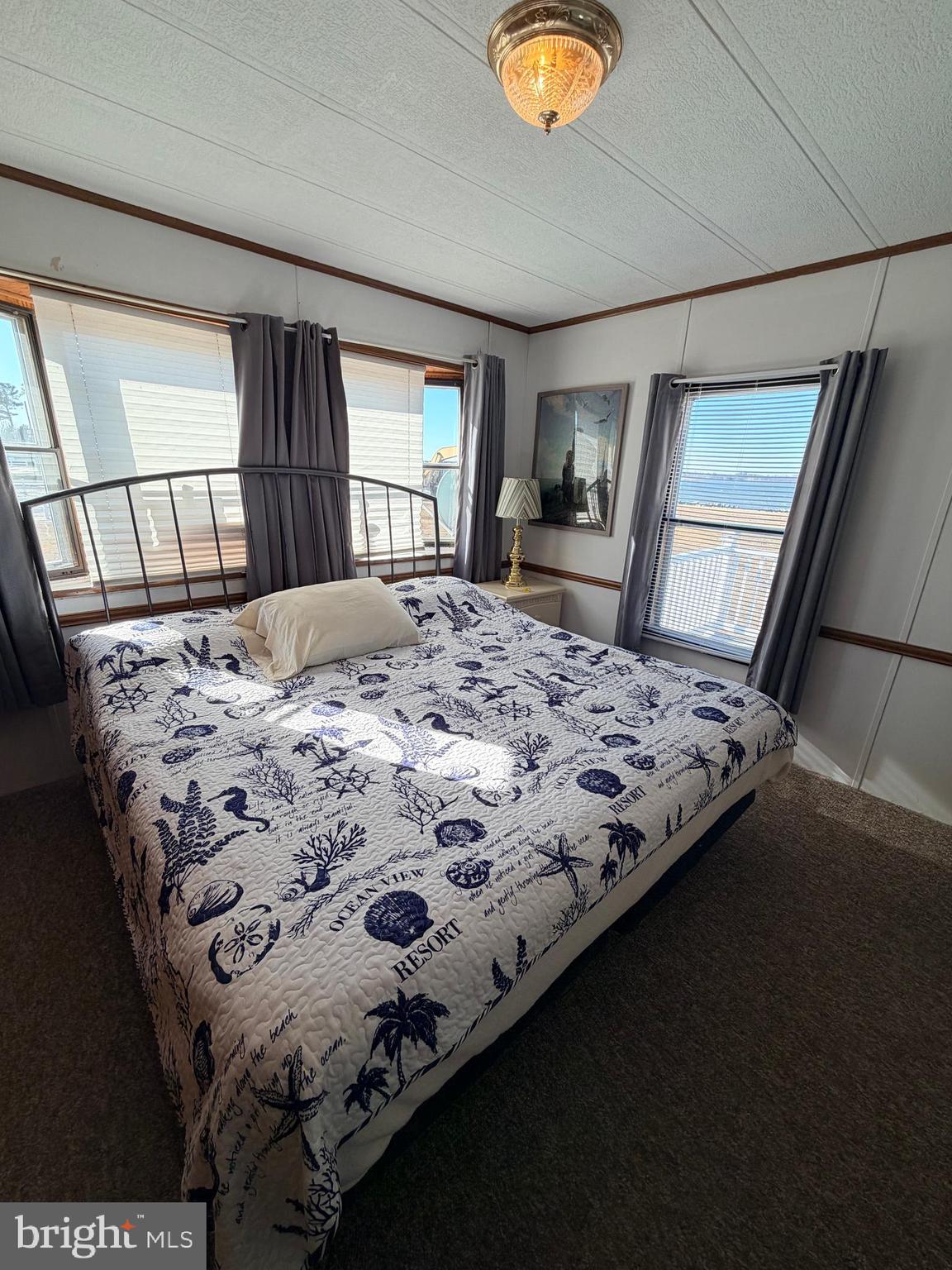 38267 Possum Road, Unit 271 Ocean View, DE 19970 - Photo 20 of 75 primary bedroom King bed/view of bay