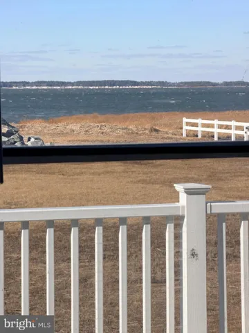 a bedroom with a bed and a television